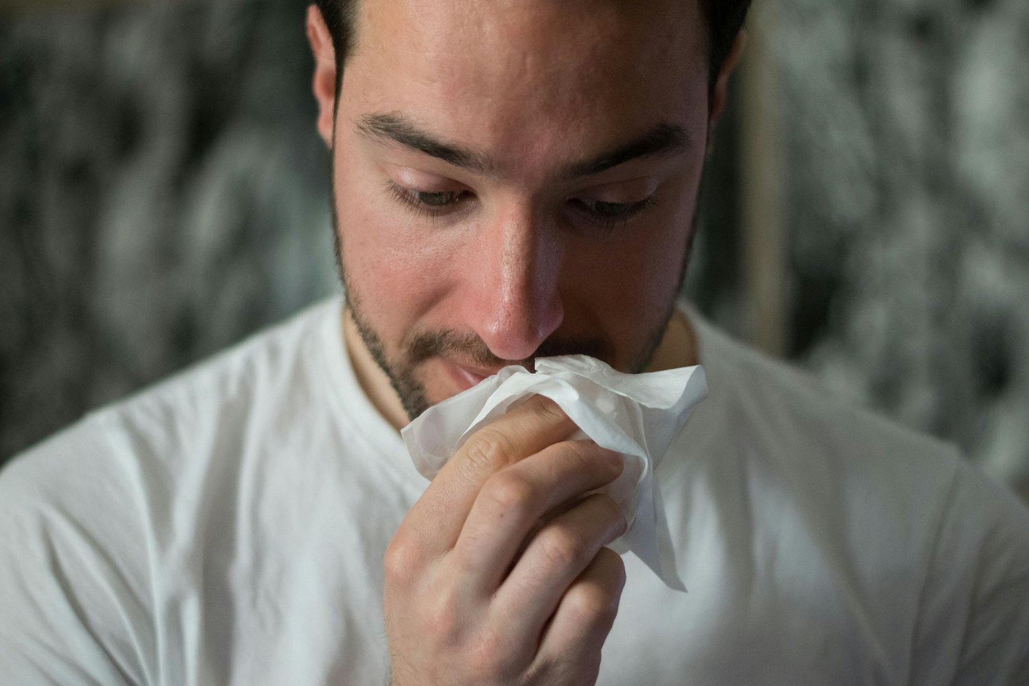 man with allergies searching for homeopathic remedies